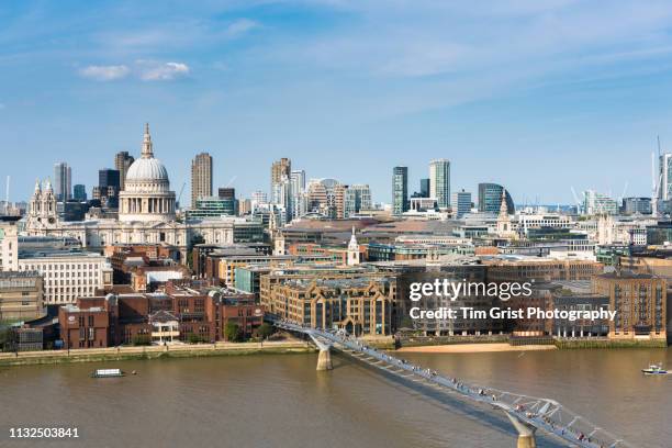 london city skyline, st paul's cathedral and millennium bridge - millennium bridge londra foto e immagini stock