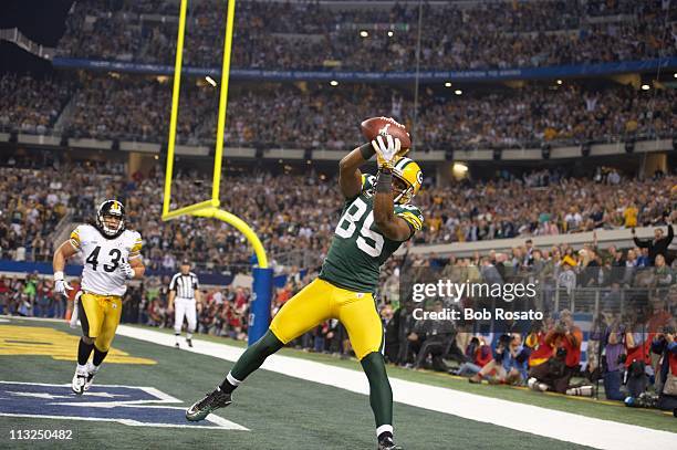 Super Bowl XLV: Green Bay Packers Greg Jennings in action, making touchdown catch vs Pittsburgh Steelers Troy Polamalu during 4th quarter at Cowboys...