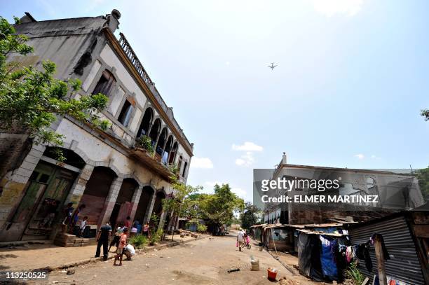 Blanca MorelChildren play outside two of the several remaining buildings partially destroyed by the earthquake of 1972 in the old centre of Managua,...