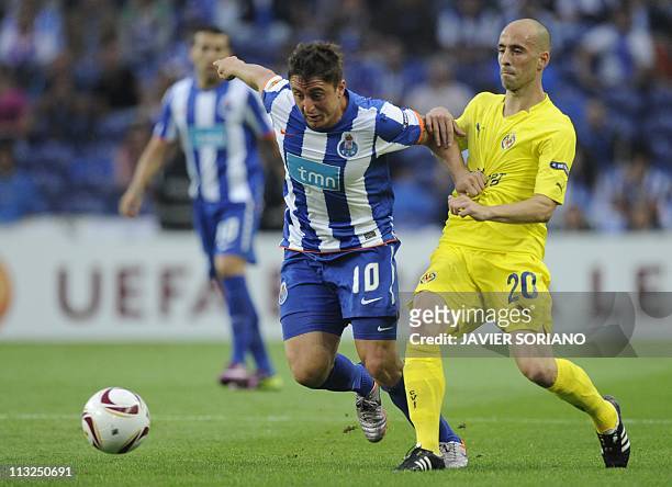 Porto's Uruguayan midfielder Cristian Rodriguez vies with Villarreal's midfielder Borja Valero during the Europa League semi-final first leg football...