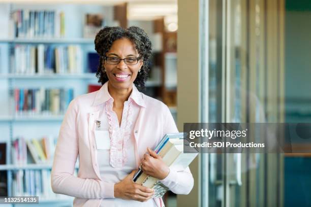 confident school librarian - librarian stock pictures, royalty-free photos & images