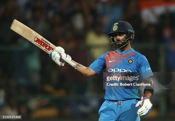 Virat Kohli of India celebrates after scoring his fifty runs during game two of the T20I Series between India and Australia at M. Chinnaswamy Stadium...