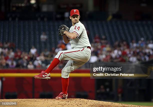 Starting pitcher Roy Oswalt of the Philadelphia Phillies pitches against the Arizona Diamondbacks during the Major League Baseball game at Chase...