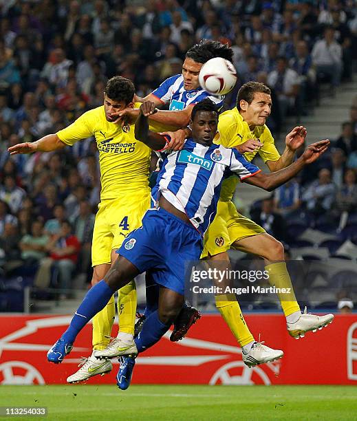 Radamel Falcao and Silvestre Varela of FC Porto duel for a high ball with Mateo Musacchio and Marco Ruben of Villarreal during the UEFA Europa League...