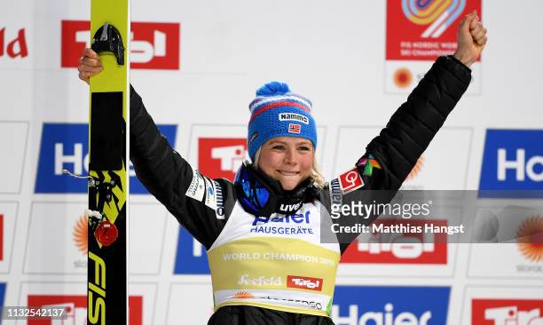 Maren Lundby of Norway celebrates winning the gold medal after the final round of the HS109 women's ski jumping Competition of the FIS Nordic World...