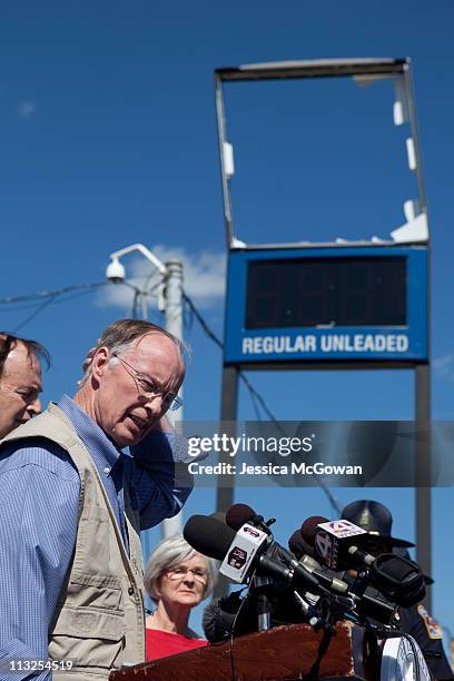 In the aftermath of Wednesday night's storms, Alabama Gov. Robert Bentley talks to media during a press conference in a destroyed area near the...