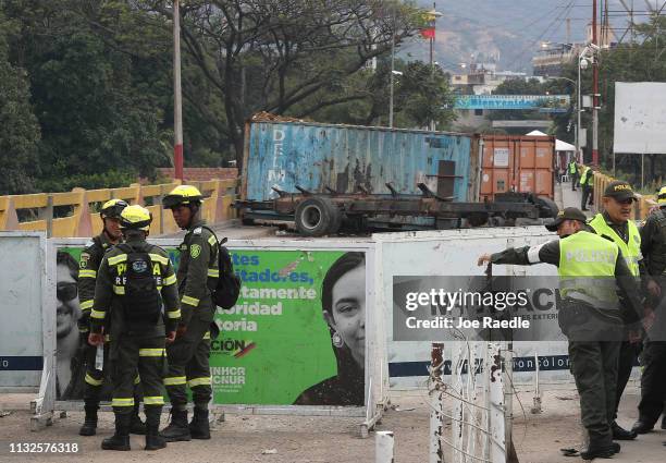 Police stand on the Colombian side of the Simón Bolívar international bridge, which connects Cúcuta with the Venezuelan town of San Antonio del...