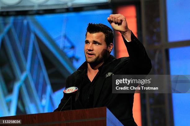 Peyton Hillis of the Cleveland Browns announces Phil Taylor as the overall pick by the Browns on stage during the 2011 NFL Draft at Radio City Music...