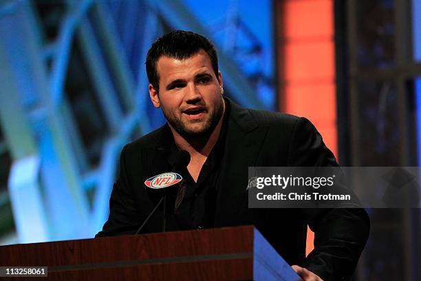 Peyton Hillis of the Cleveland Browns announces Phil Taylor as the overall pick by the Browns on stage during the 2011 NFL Draft at Radio City Music...