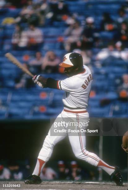 Al Bumbry of the Baltimore Orioles swings and watches the flight of his ball during a Major League Baseball game circa 1983 at Memorial Stadium in...