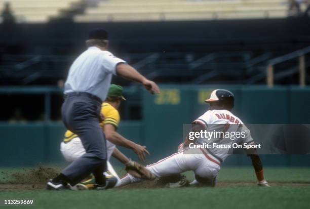 Al Bumbry of the Baltimore Orioles slides into second base against the Oakland Athletics during a Major League Baseball game circa 1975 at Memorial...