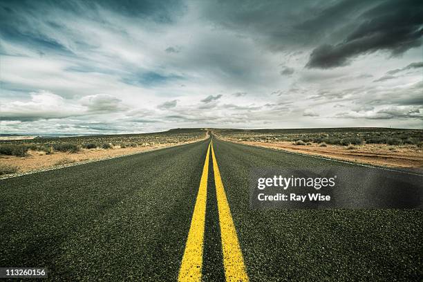 the road to nowhere - single yellow line stock pictures, royalty-free photos & images