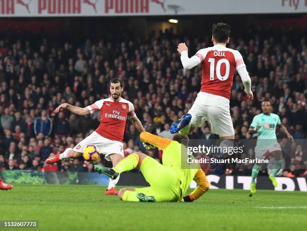 Henrikh Mkhitaryan scores the 2nd Arsenal goal after a pass from Mesut Ozil during the Premier League match between Arsenal FC and AFC Bournemouth at...