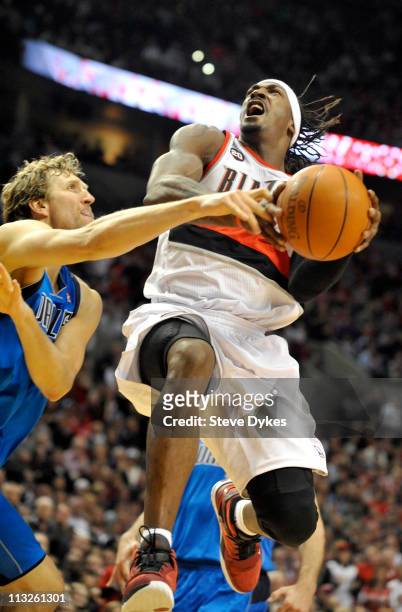 Gerald Wallace of the Portland Trail Blazers is fouled by Dirk Nowitzki of the Dallas Mavericks during the fourth quarter of Game Six of the Western...