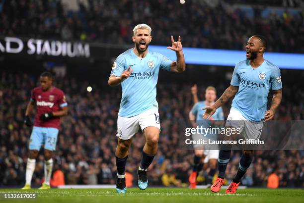 Sergio Aguero of Manchester City celebrates after scoring his team's first goal with Raheem Sterling of Manchester City during the Premier League...
