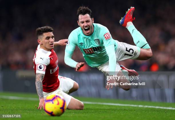 Lucas Torreira of Arsenal tackles Adam Smith of AFC Bournemouth during the Premier League match between Arsenal FC and AFC Bournemouth at Emirates...