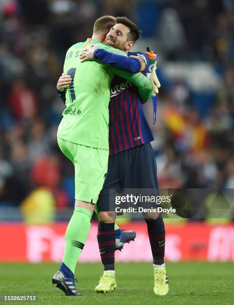 Goalkeeper Marc-Andre ter Stegen of FC Barcelona hugs Lionel Messi after the Copa del Rey Semi Final second leg match between Real Madrid and FC...