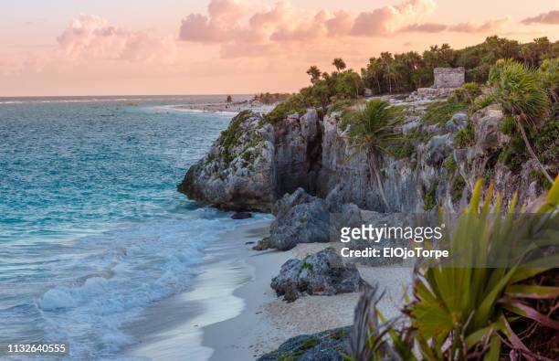 ruins in tulum in coastline, beach, sunset, mexico - tulum stock pictures, royalty-free photos & images