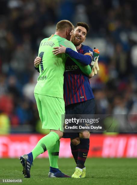 Goalkeeper Marc-Andre ter Stegen of FC Barcelona hugs Lionel Messi after the Copa del Rey Semi Final second leg match between Real Madrid and FC...