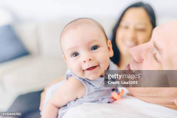 dad holding 4 month old baby girl - happy newborn stock pictures, royalty-free photos & images