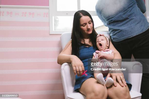 family in the baby's room - yawning mother child stock pictures, royalty-free photos & images
