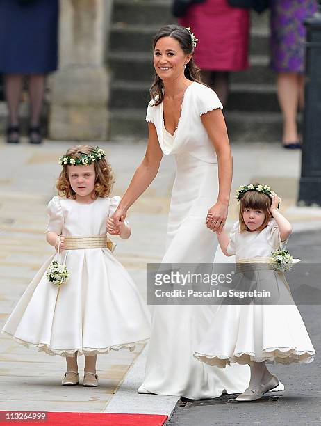 Sister of the bride and Maid of Honour Pippa Middleton holds hands with Grace Van Cutsem and Eliza Lopes as they arrive to attend the Royal Wedding...