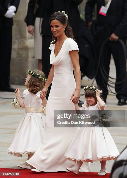 Sister of the bride and Maid of Honour Pippa Middleton holds hands with Grace Van Cutsem and Eliza Lopes as they arrive to attend the Royal Wedding...
