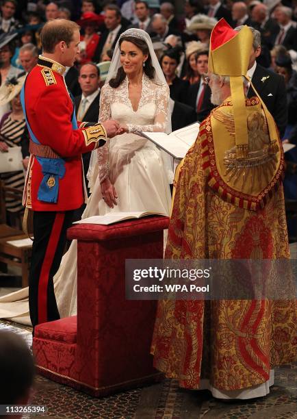 Prince William exchanges rings with his bride Catherine Middleton in front of the Archbishop of Canterbury Rowan Williams inside Westminster Abbey on...