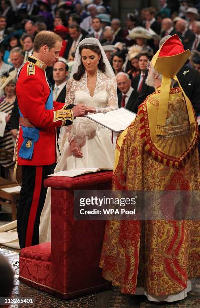 Prince William exchanges rings with his bride Catherine Middleton in front of the Archbishop of Canterbury Rowan Williams inside Westminster Abbey on...