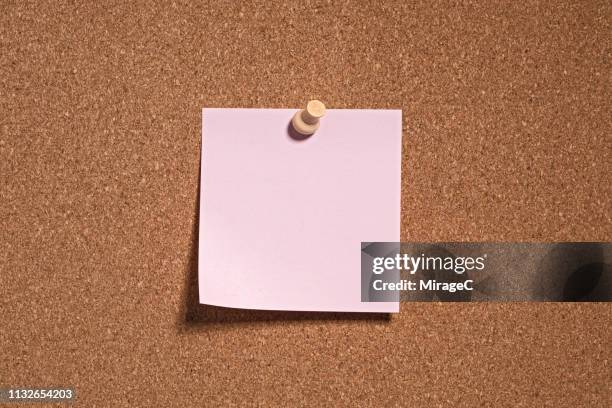 pink colored note paper on cork board - pinning stock pictures, royalty-free photos & images