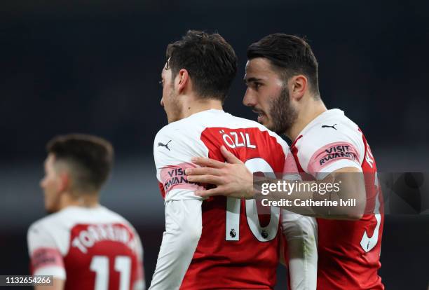 Sead Kolasinac of Arsenal speaks to Mesut Ozil of Arsenal during the Premier League match between Arsenal FC and AFC Bournemouth at Emirates Stadium...