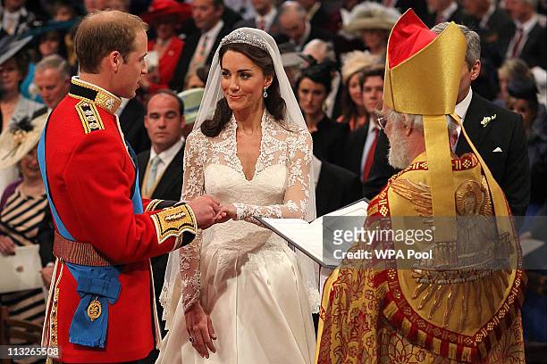Prince William exchanges rings with his bride Catherine Middleton in front of the Archbishop of Canterbury Rowan Williams inside Westminster Abbey on...