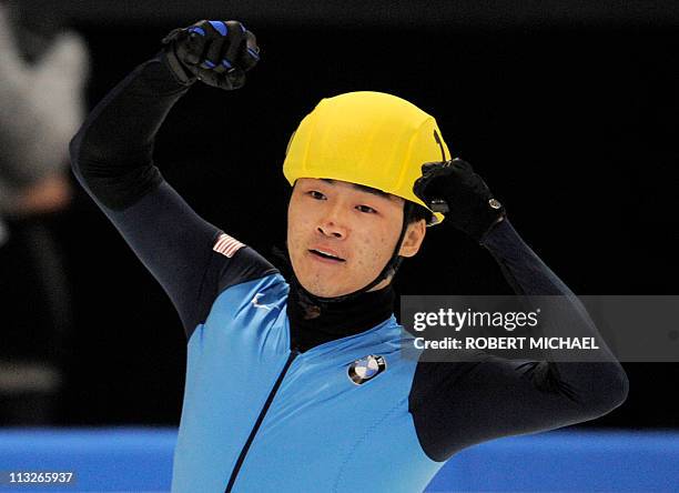 Simon Cho of the US celebrates winning the men's 500m finals of the ISU World Cup short track speed skating final event in Dresden, eastern Germany,...