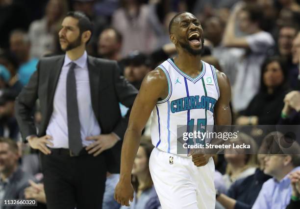 Kemba Walker of the Charlotte Hornets reacts as head coach James Borrego of the Charlotte Hornets watches on during their game against the Houston...