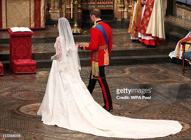 Prince William and Catherine Middleton walk to the altar during their wedding service in Westminster Abbey on April 29, 2011 in London, England. The...