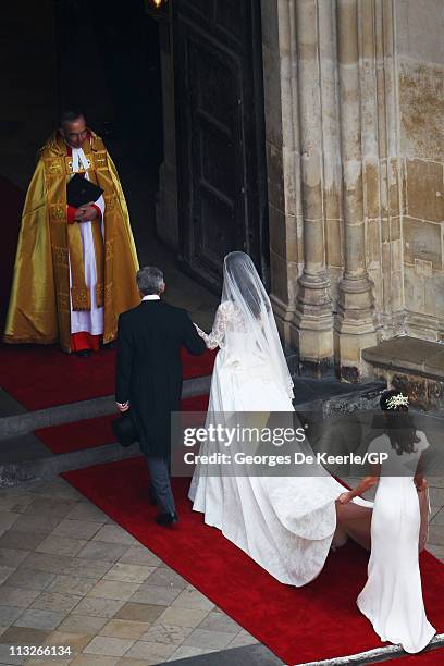 Catherine Middleton with her father Michael Middleton and Maid of Honour Pippa Middleton are greeted by The Very Reverend Dr John Hall, Dean of...