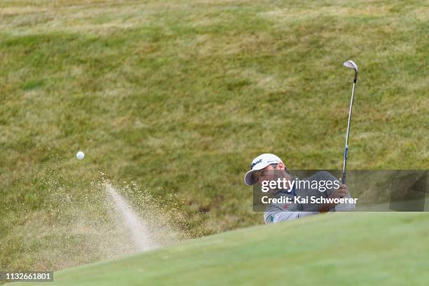 Michael Hendry of New Zealand plays a bunker shot during day one of the 2019 New Zealand Open at The Hills Golf Club on February 28, 2019 in...