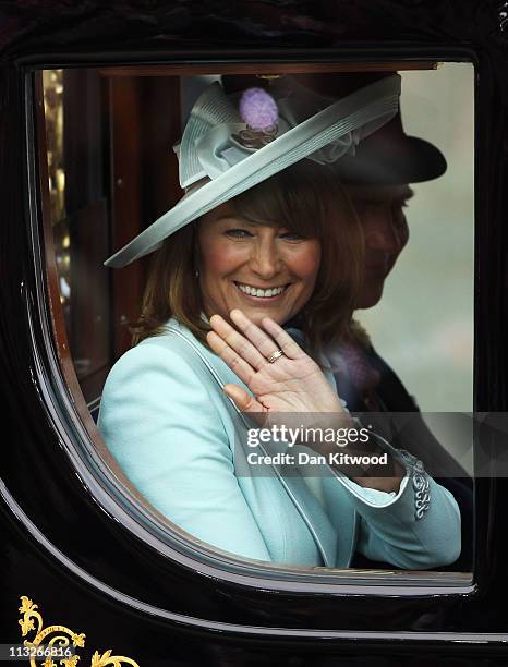 Michael Middleton and Carole Middleton ride in a carriage procession to Buckingham Palace following the marriage of Their Royal Highnesses Prince...