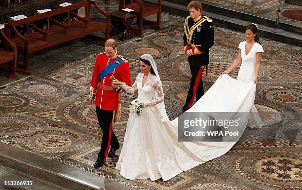 Prince William takes the hand of his bride Catherine Middleton, now to be known as Catherine, Duchess of Cambridge, followed by Prince Harry and...