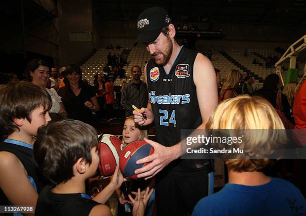 Dillon Boucher of the Breakers signs his autograph after winning game three of the NBL Grand Final series between the New Zealand Breakers and the...