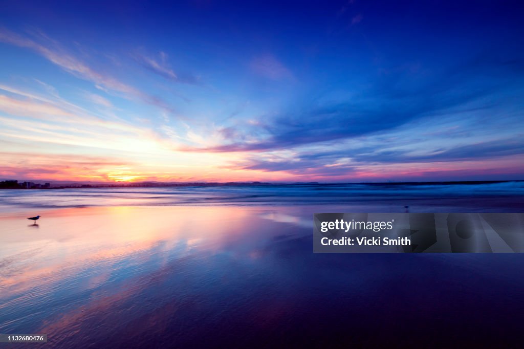 Beautiful yellow and blue sky Sunrise over the ocean