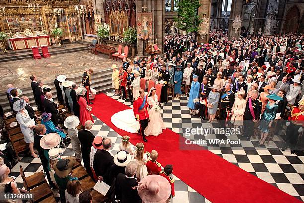 Prince William and his new bride Catherine Middleton walk down the aisle at the close of their wedding ceremony at Westminster Abbey on April 29,...