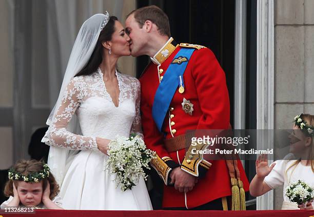 Their Royal Highnesses Prince William, Duke of Cambridge and Catherine, Duchess of Cambridge kiss on the balcony at Buckingham Palace on April 29,...