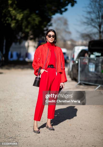 Brittany Xavier is seen wearing red pants, turtleneck, jacket outside Unravel Project during Paris Fashion Week Womenswear Fall/Winter 2019/2020 on...