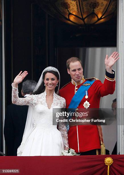 Catherine, Duchess of Cambridge and Prince William, Duke of Cambridge wave to wellwishers on the balcony at Buckingham Palace on April 29, 2011 in...