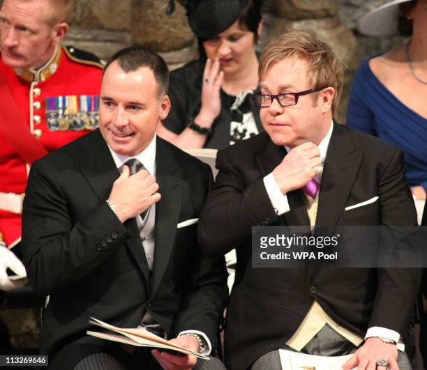 Sir Elton John and his partner David Furnish attend the service inside Westminster Abbey on April 29, 2011 in London, England. The marriage of Prince...