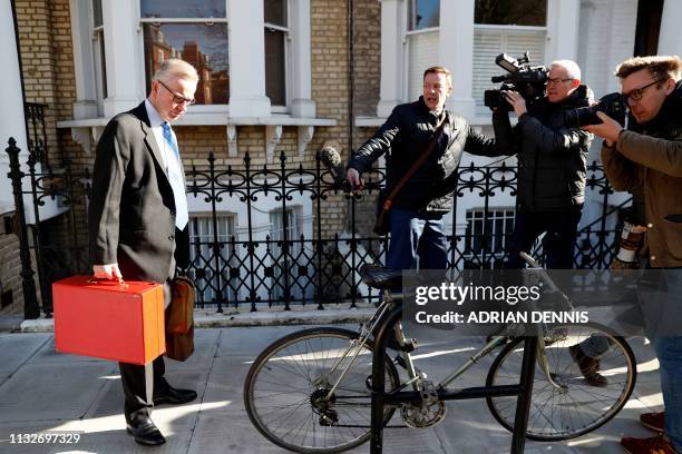 Britain's Environment, Food and Rural Affairs Secretary Michael Gove leaves his residence in west London on March 25, 2019. - British Prime Minister...