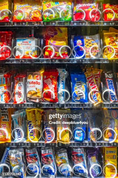 a vending machine offers sweets and snacks at the train station in hamburg - candy chocolate gum stock pictures, royalty-free photos & images
