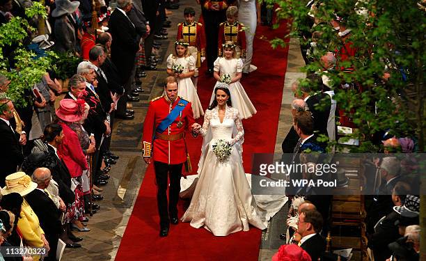 Prince William, Duke of Cambridge and his new bride Catherine, Duchess of Cambridge walk down the aisle at the close of their wedding ceremony at...