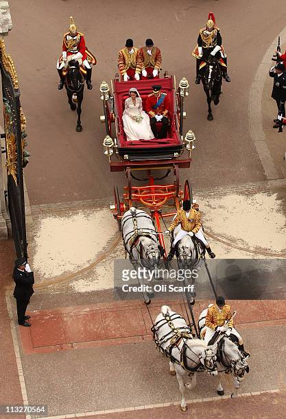 Prince William, Duke of Cambridge and Catherine, Duchess of Cambridge enter Buckingham Palace by carriage procession following their marriage at...
